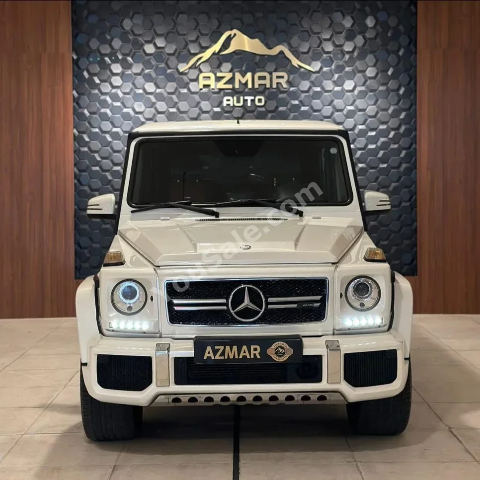 مرسيدس - بنز جي - كلاس 63 AMG 2013 اتوماتيك 90,000 كم 8 سلندر دفع رباعي اس يو في أبيض بنزين