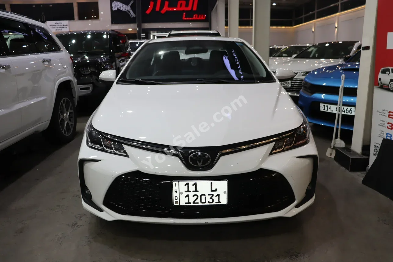 تويوتا  كورولا  2024  اتوماتيك  0 كم  4 سلندر  دفع أمامي  سيدان  أبيض  هايبرد